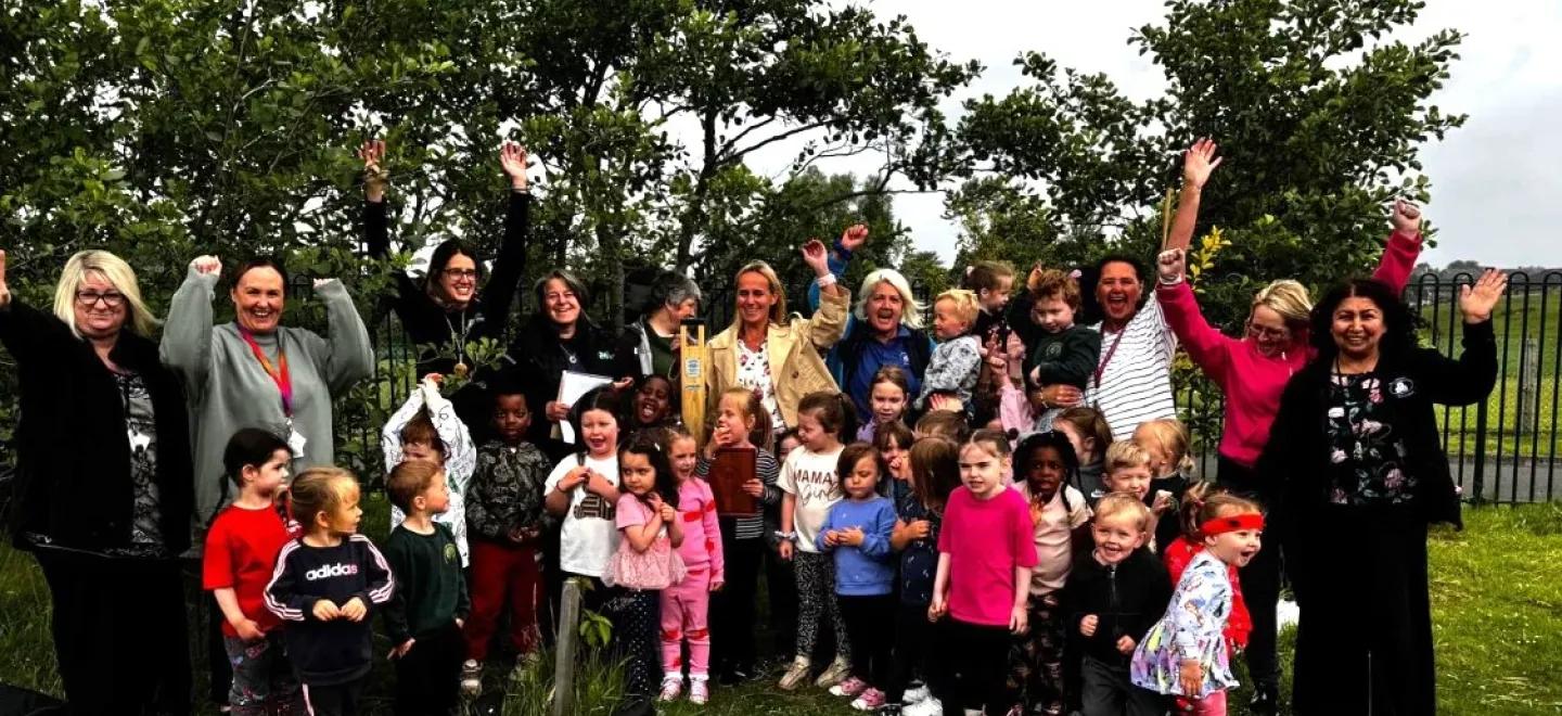 Group photo of pupils and teachers at West Johnstone ELCC celebrating