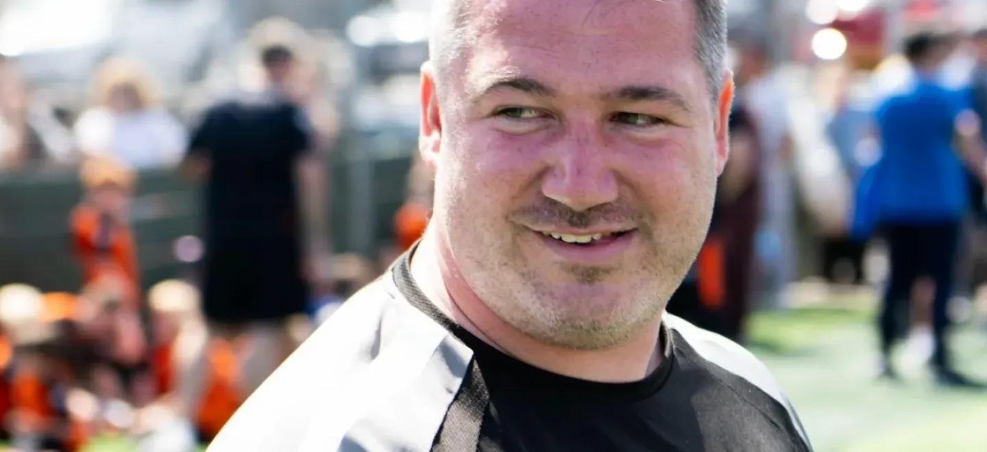 Member of Glenvale Football Club looking to the side