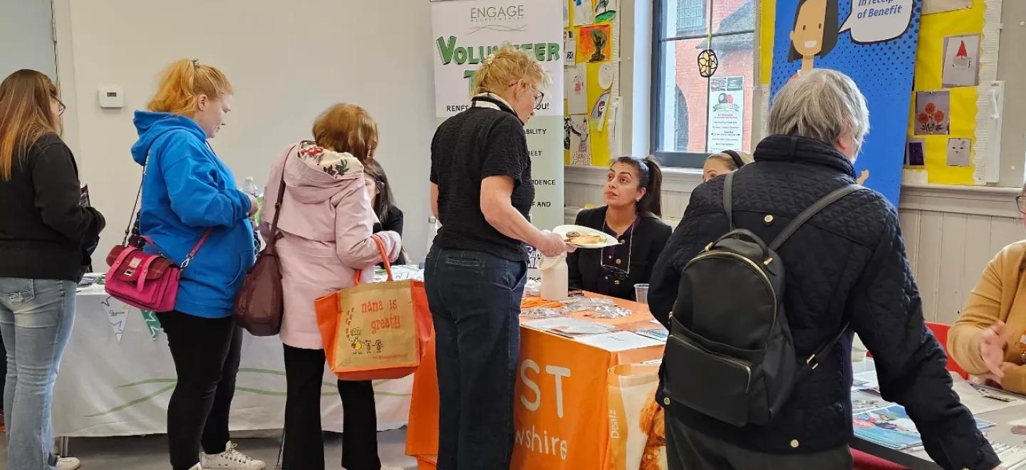 Group of people at the volunteer recruitment event in Paisley