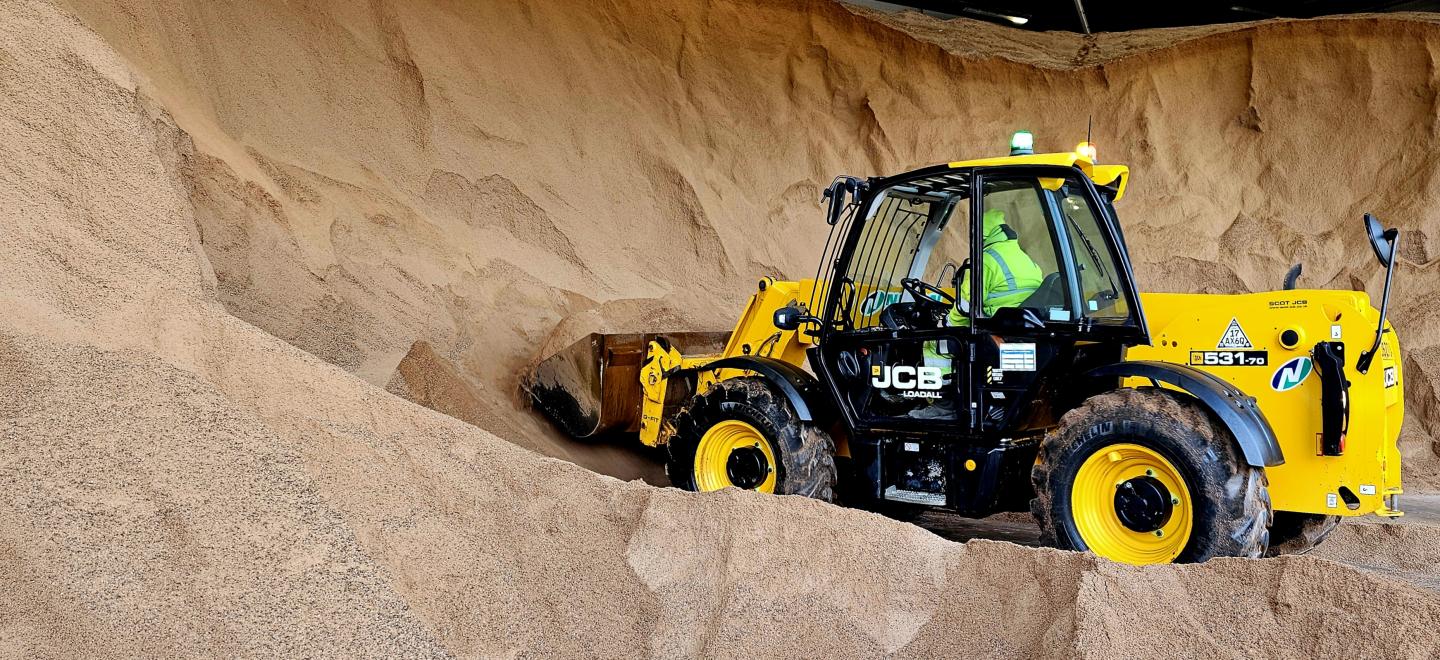 Gritter collecting grit from the grit store