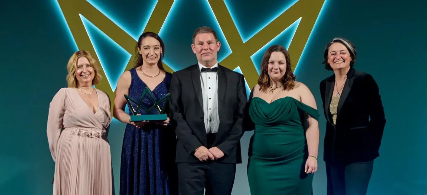 Karen Mann, Mark Hughes, Shannon Duffy, and presenters from the awards.