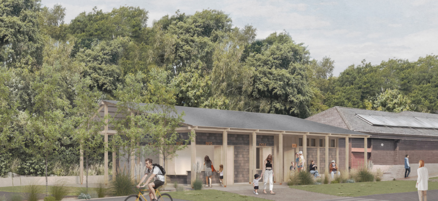 An artist's impression of a new cycle hub facility. It shows pillars enclosing the main wooden building with walkers and a cyclist in front, with green trees in the background