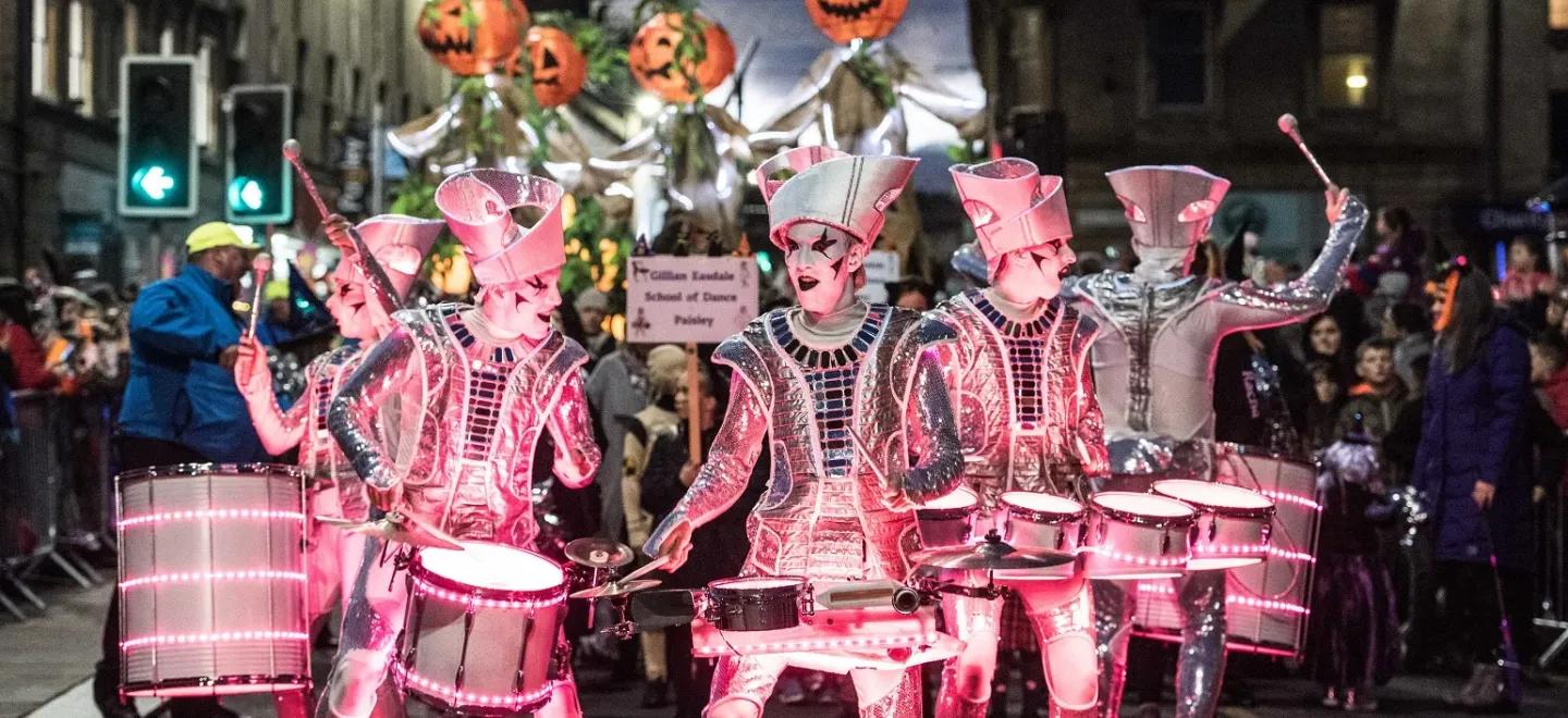 Spark! LED Drummers perform in the parade as part of Paisley Halloween Festival
