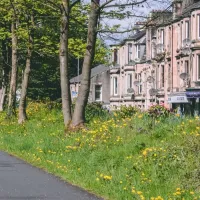 Walking path beside a row of houses in Bridge of Weir.